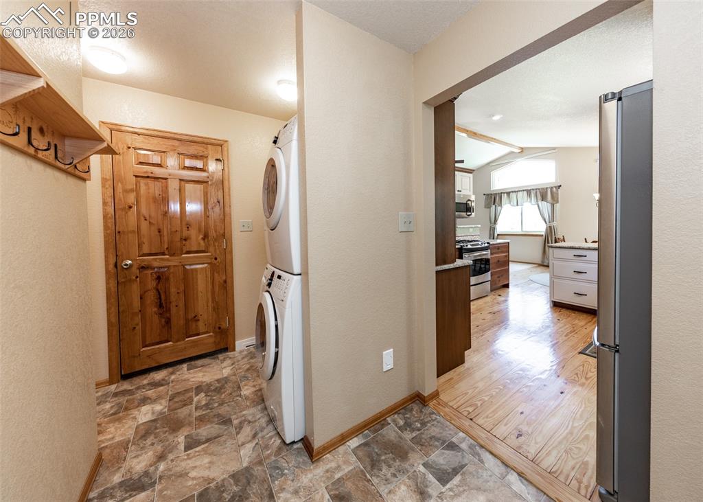 2602 Southpark Road Florissant, CO 80816 - Photo 23 of 50 View from garage door into laundry area and kitchen. Washer and dryer stay with the home.