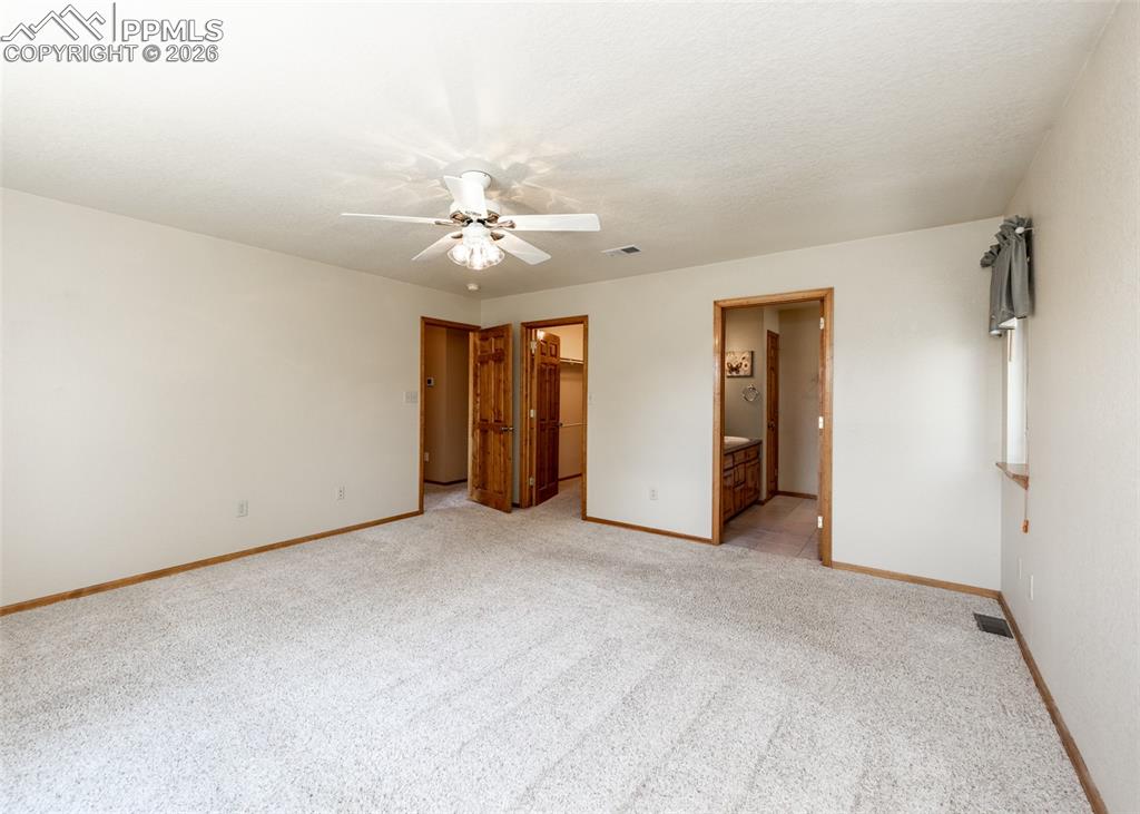 2602 Southpark Road Florissant, CO 80816 - Photo 25 of 50 The primary bedroom is generous and bright.