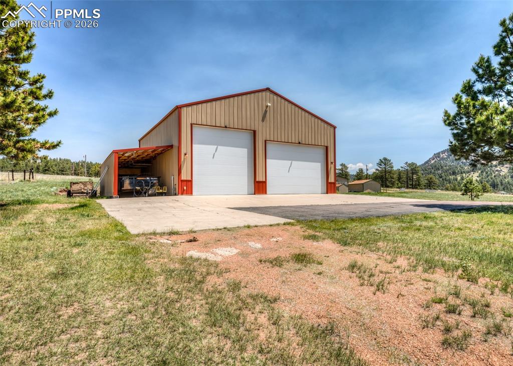 2602 Southpark Road Florissant, CO 80816 - Photo 4 of 50 Look at that RV garage! 40'x40'ish=1680 sq.ft! What a dream! Also has covered 10'x36'x8' lean-to shed storage on the side.