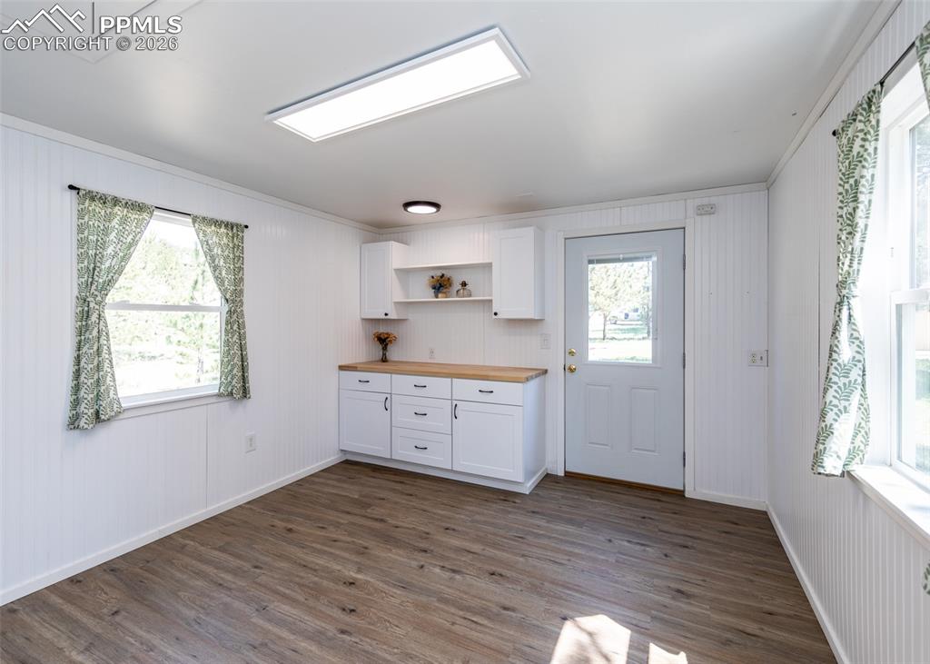 2602 Southpark Road Florissant, CO 80816 - Photo 43 of 50 Isn't this just the coziest space? Inside the cottage has electricity, heat, new LVP, butcherblock countertop and cabinetry. It's insulated and even has an attic for additional storage.