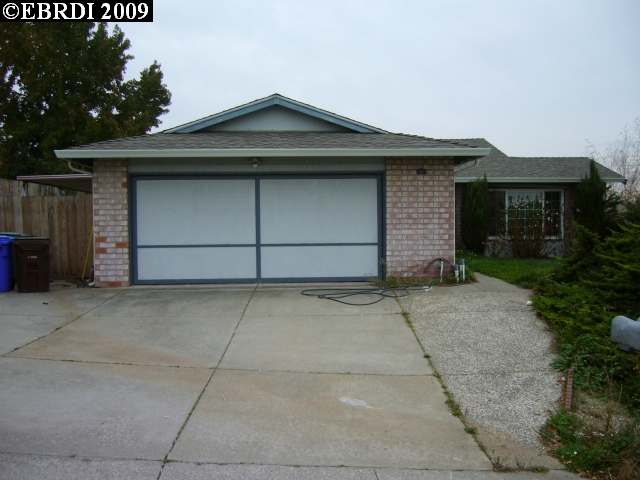 962 Viewpointe Boulevard Rodeo, CA 94572 - Photo 1 of 1 a front view of a house with a yard and garage