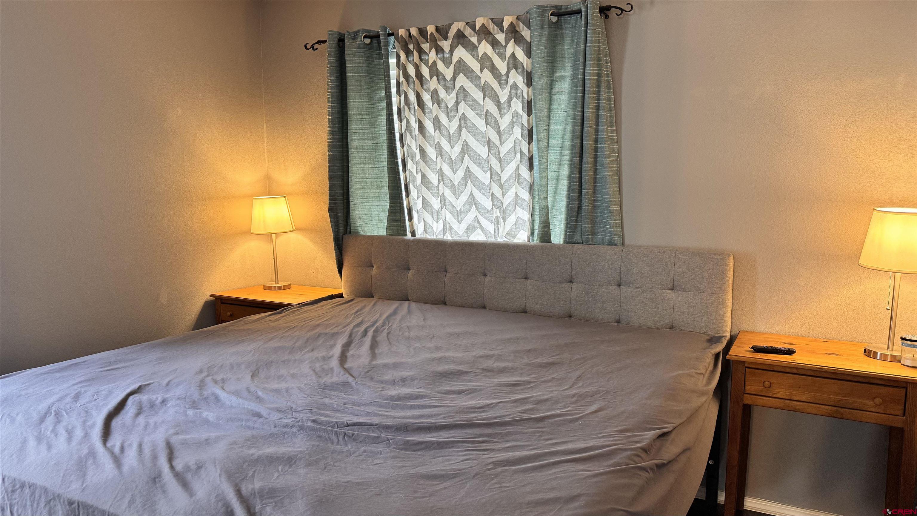 1100 Goeglein Gulch Road, Unit 204 Durango, CO 81301 - Photo 16 of 42 a bedroom with a bed and a window