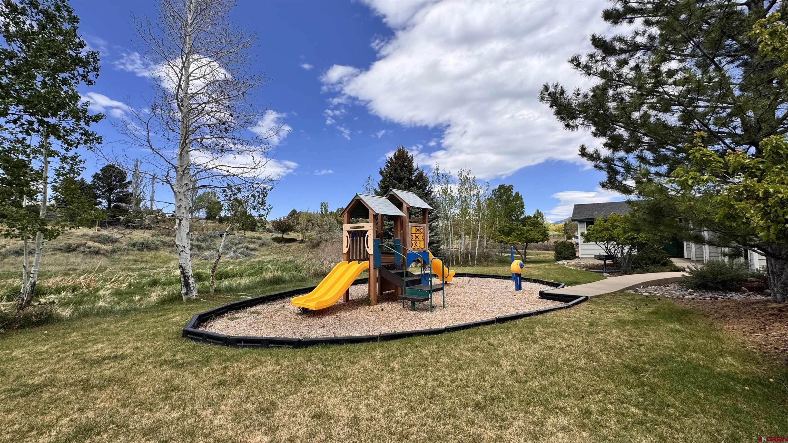 1100 Goeglein Gulch Road, Unit 204 Durango, CO 81301 - Photo 31 of 42 a view of a fountain in the middle of a yard