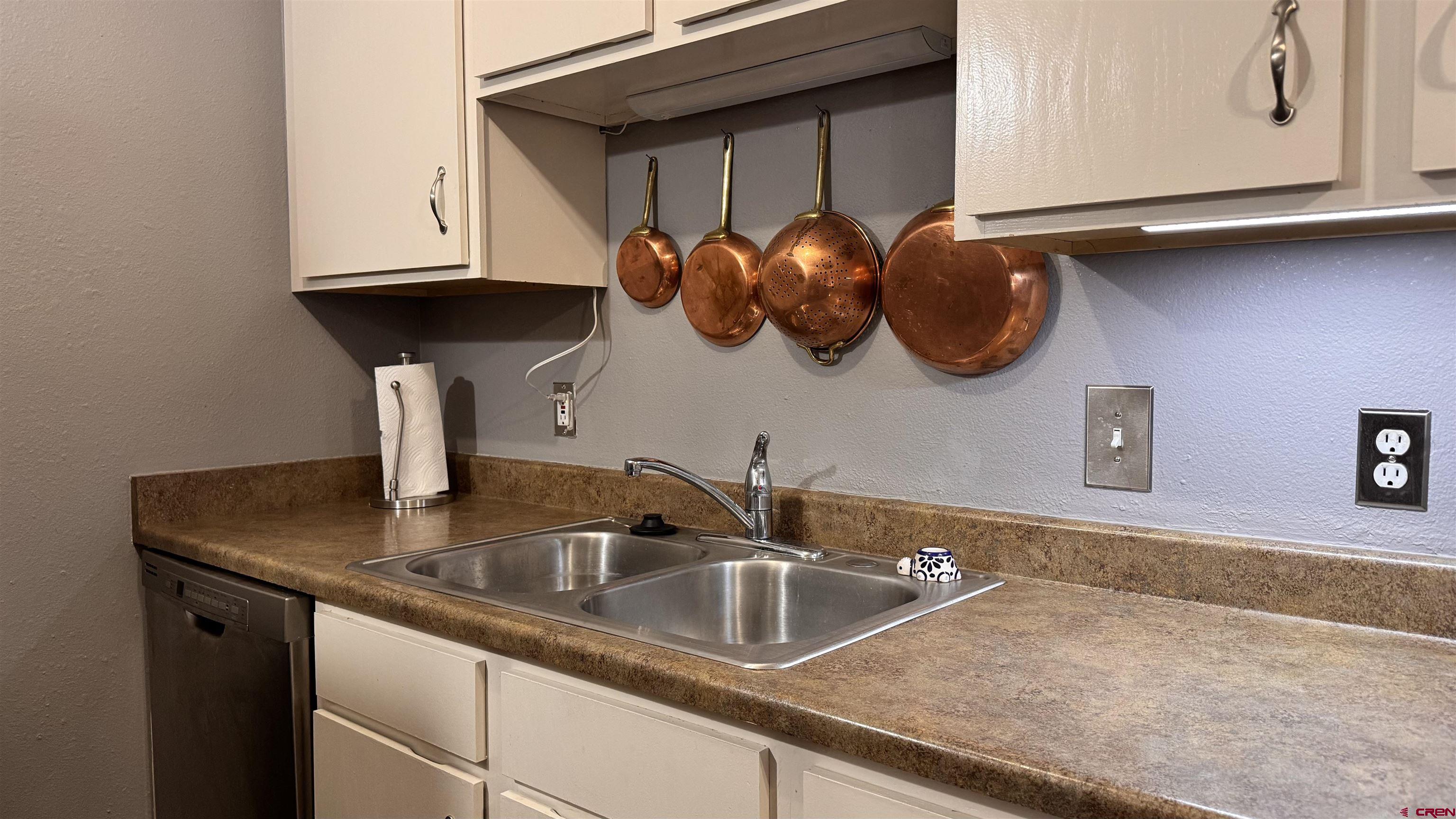 1100 Goeglein Gulch Road, Unit 204 Durango, CO 81301 - Photo 9 of 42 a close view of sink and tap