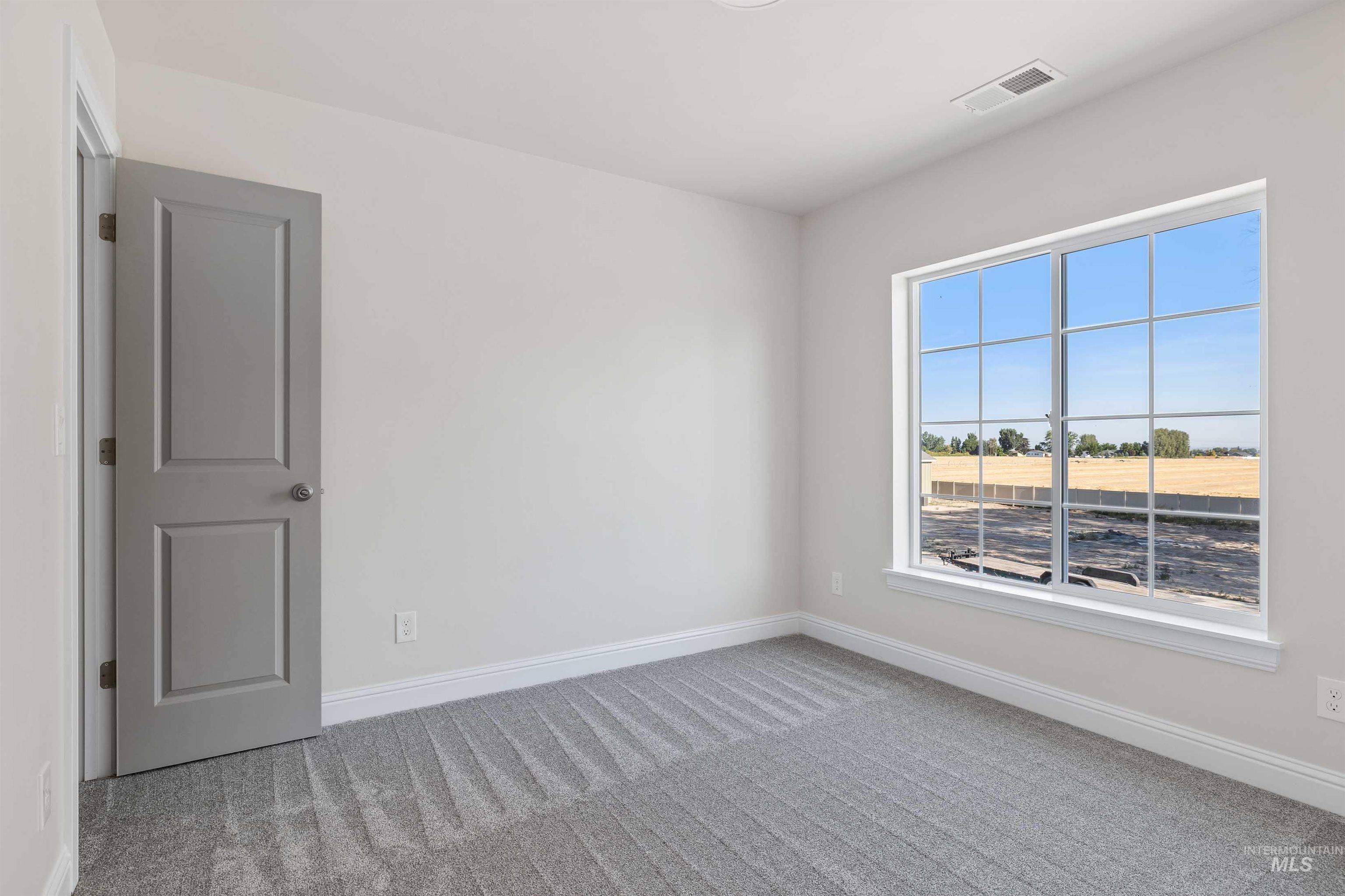867 Adamite Road Kimberly, ID 83341 - Photo 14 of 24 Carpeted empty room with baseboards
