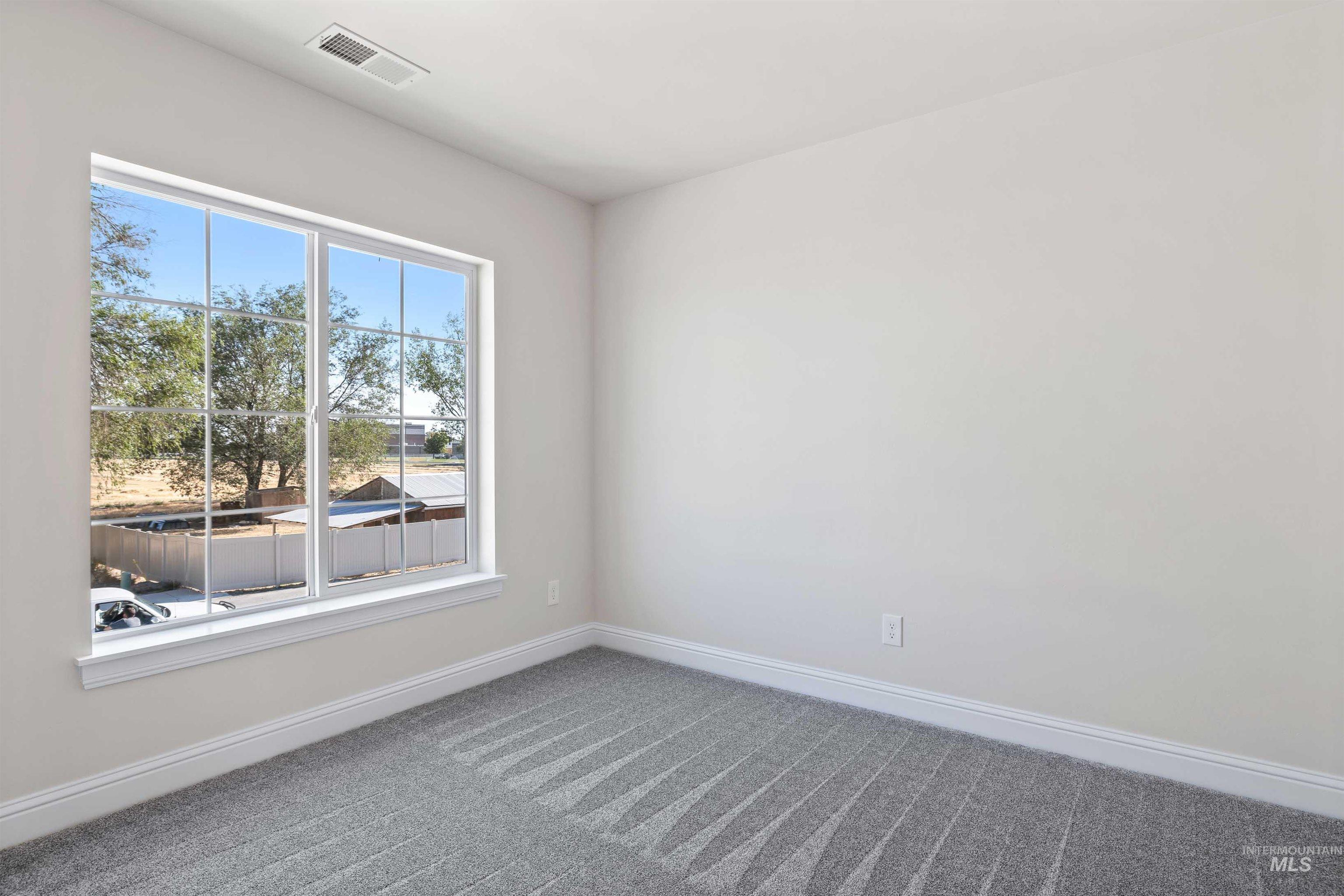 867 Adamite Road Kimberly, ID 83341 - Photo 16 of 24 Carpeted spare room with baseboards