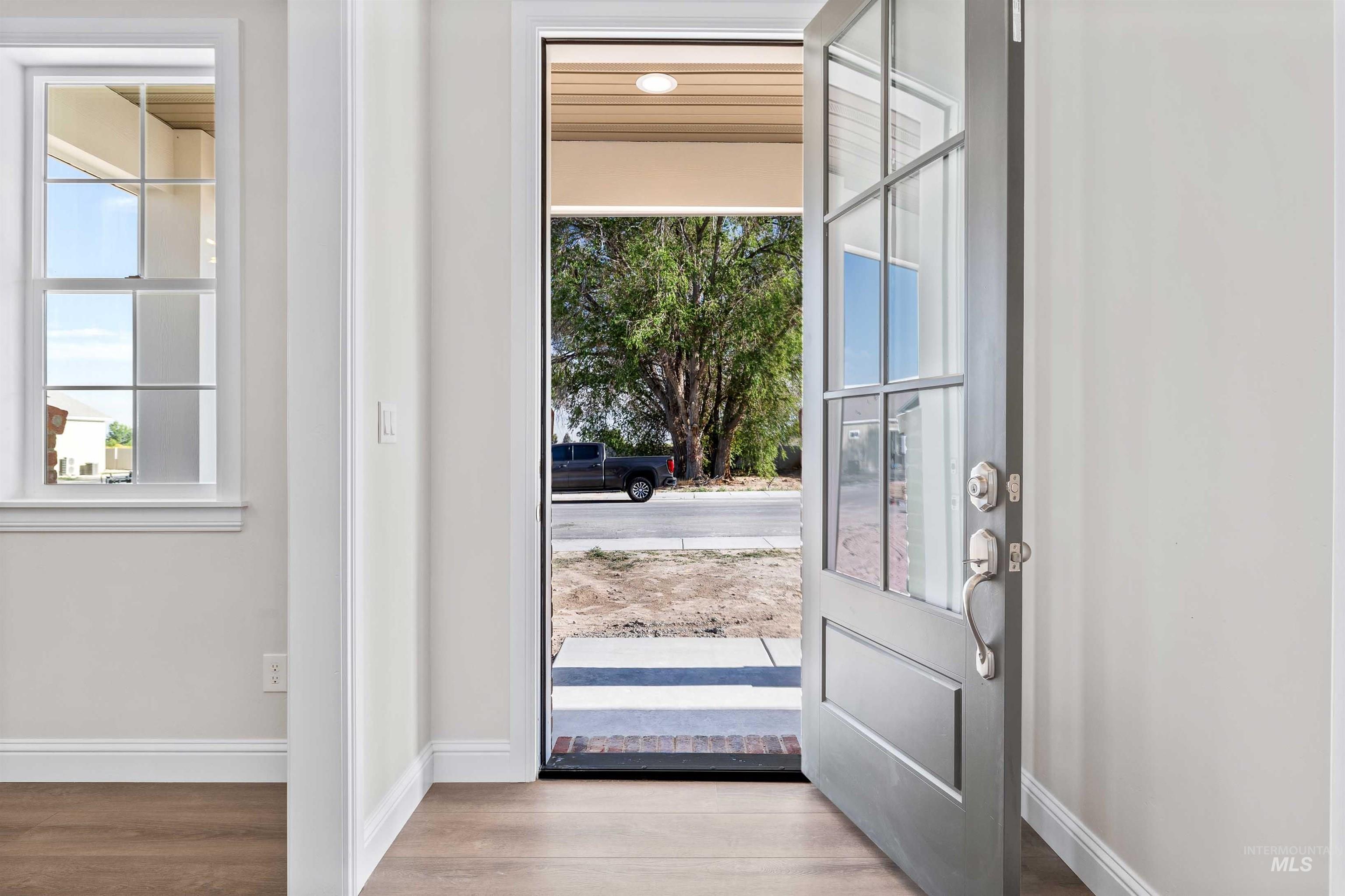 867 Adamite Road Kimberly, ID 83341 - Photo 3 of 24 Doorway to outside with wood finished floors and baseboards