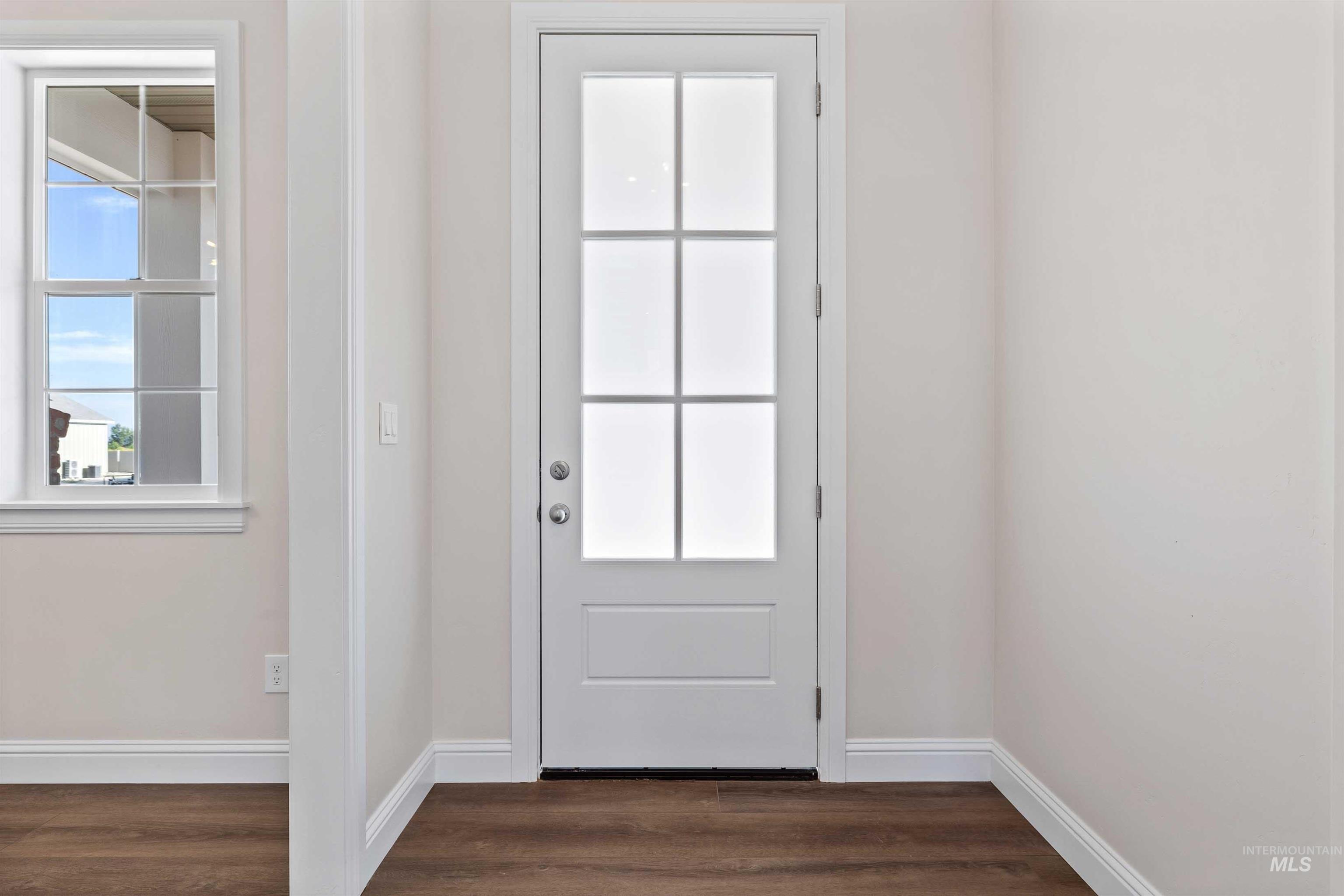 867 Adamite Road Kimberly, ID 83341 - Photo 4 of 24 Doorway to outside with dark wood-style flooring