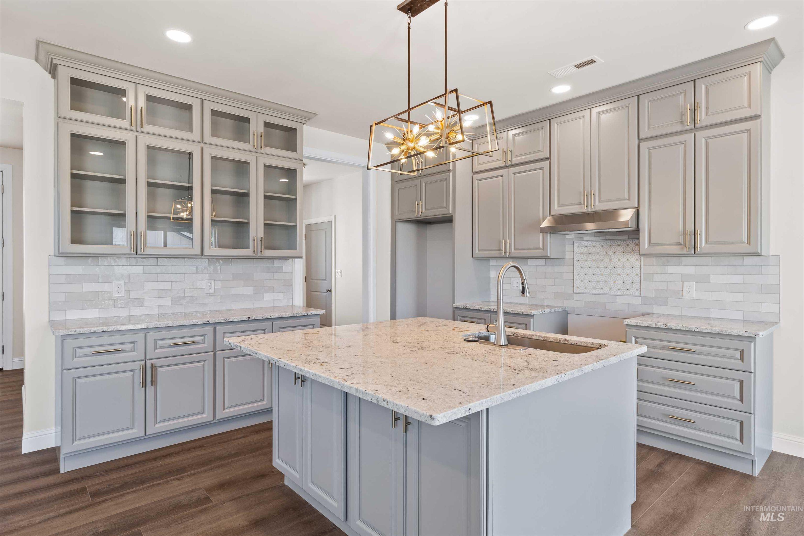 867 Adamite Road Kimberly, ID 83341 - Photo 7 of 24 Kitchen featuring gray cabinets, backsplash, recessed lighting, glass insert cabinets, and dark wood-type flooring