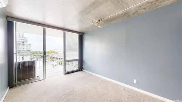 a view of an empty room with a window