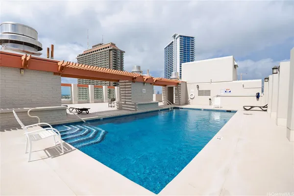a view of a patio with swimming pool