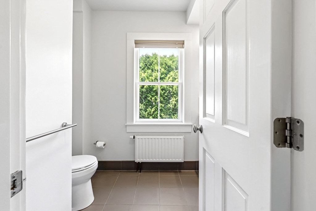 58 Front Street Northampton, MA 01053 - Photo 20 of 42 a bathroom with a toilet sink and tub