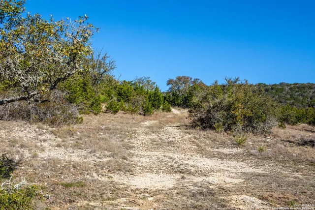 a view of a large body of water with a building in the background