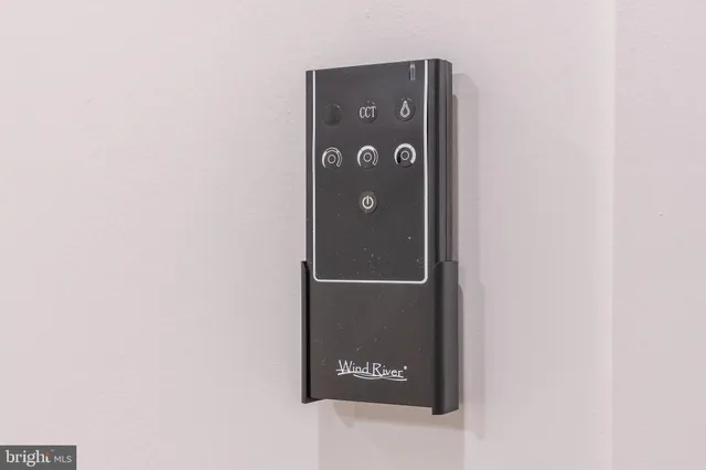 a bedroom with bed and a chair