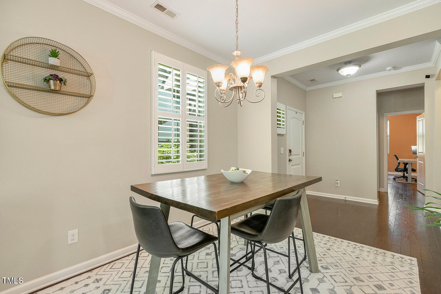 2425 Baslow Drive Apex, NC 27539 - Photo 13 of 48 a view of a dining room with furniture window and wooden floor