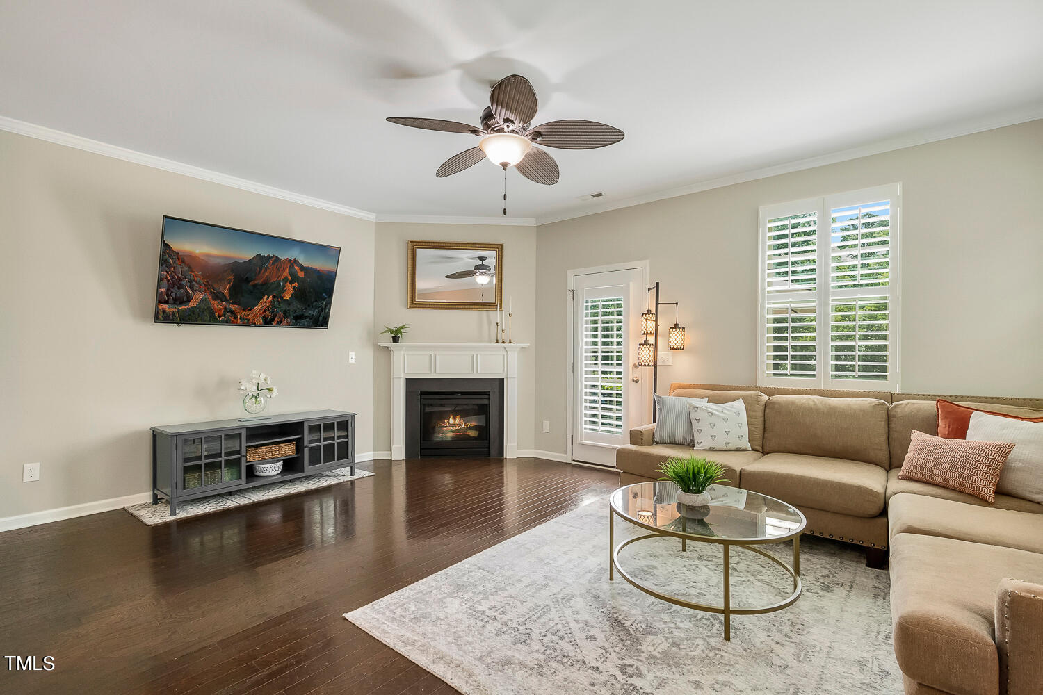 2425 Baslow Drive Apex, NC 27539 - Photo 17 of 48 a living room with furniture and a fireplace