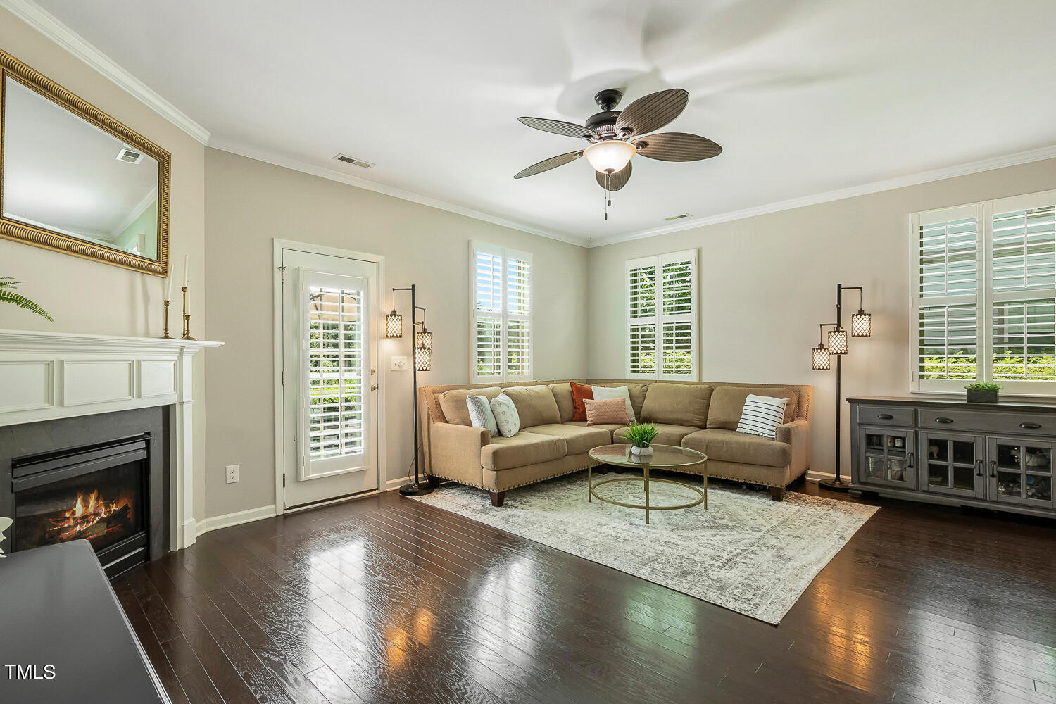 2425 Baslow Drive Apex, NC 27539 - Photo 18 of 48 a living room with furniture and a fireplace