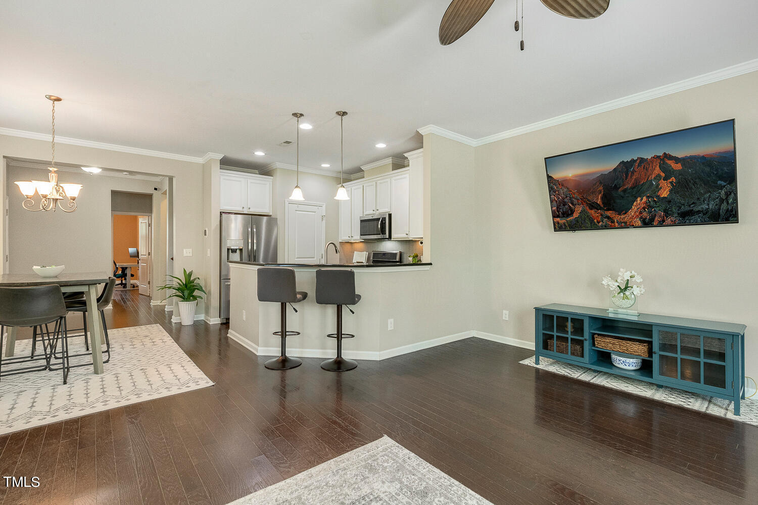 2425 Baslow Drive Apex, NC 27539 - Photo 19 of 48 a living room with furniture and a flat screen tv