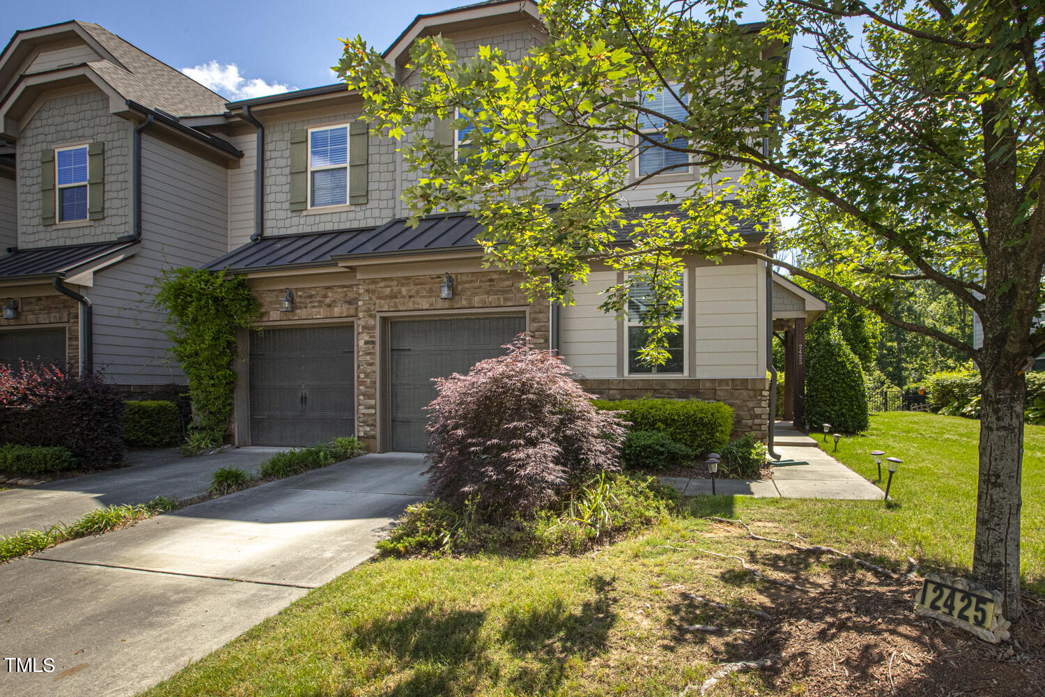 2425 Baslow Drive Apex, NC 27539 - Photo 2 of 48 a view of a front of house with a yard