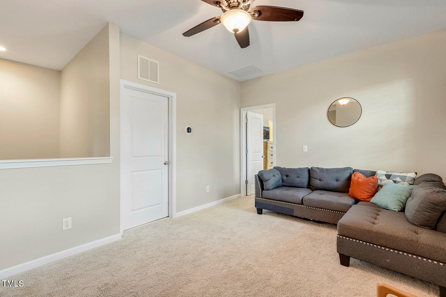 2425 Baslow Drive Apex, NC 27539 - Photo 24 of 48 a living room with furniture and a ceiling fan