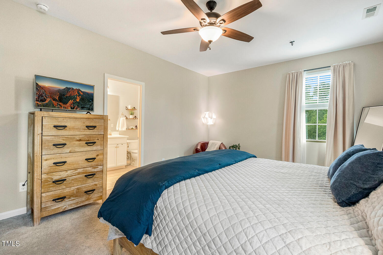 2425 Baslow Drive Apex, NC 27539 - Photo 29 of 48 a bedroom with a bed and ceiling fan