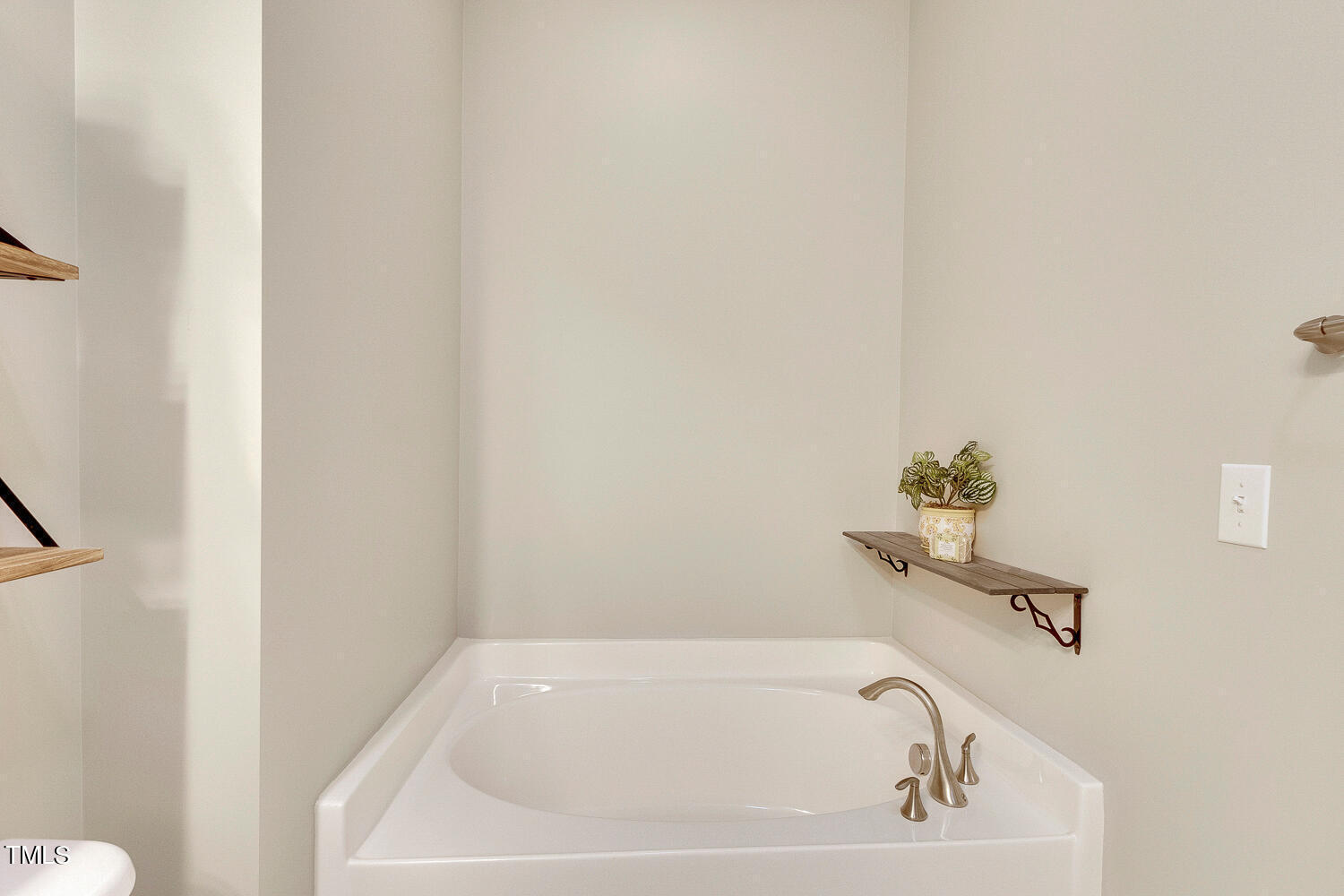 2425 Baslow Drive Apex, NC 27539 - Photo 32 of 48 a white bath tub sitting in a bathroom