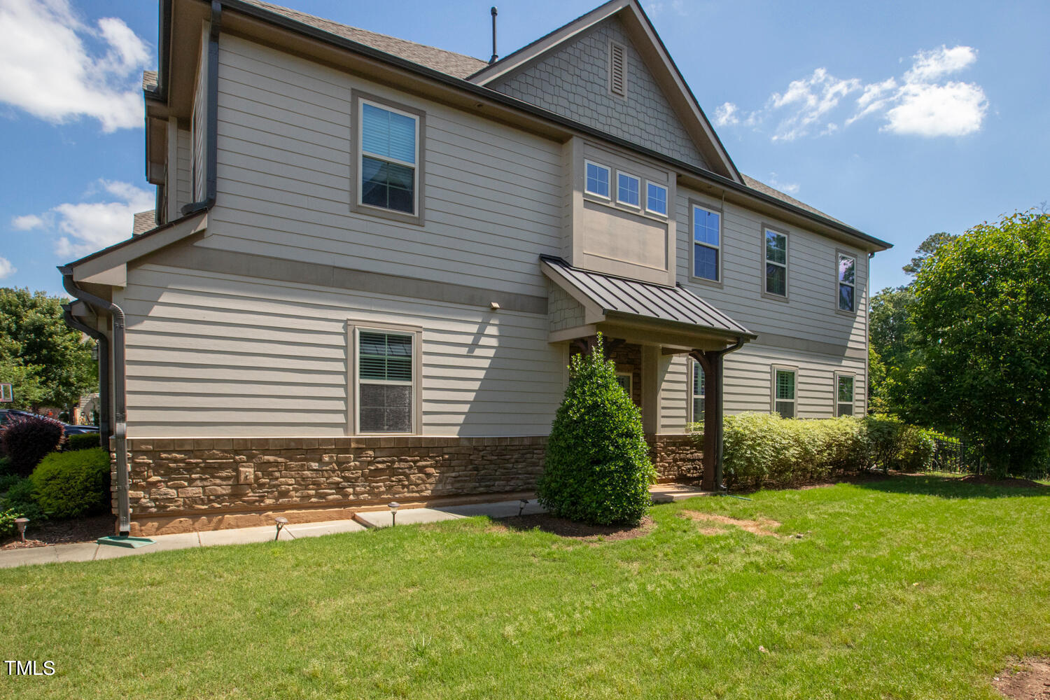 2425 Baslow Drive Apex, NC 27539 - Photo 4 of 48 a front view of a house with garden
