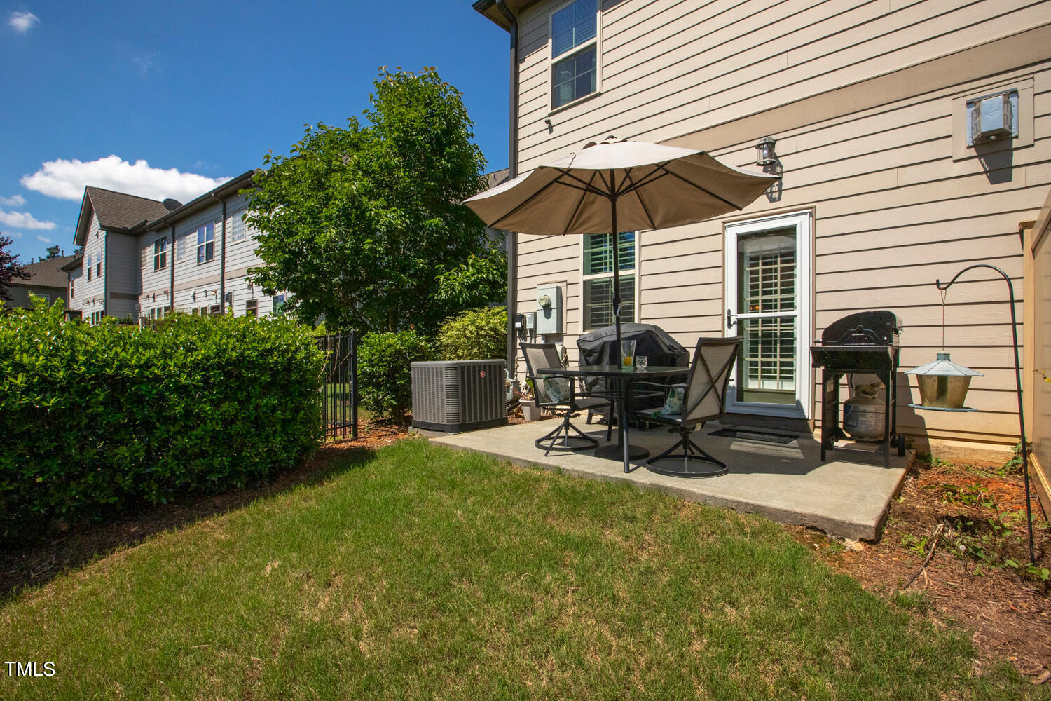2425 Baslow Drive Apex, NC 27539 - Photo 42 of 48 a view of backyard with a patio and outdoor seating