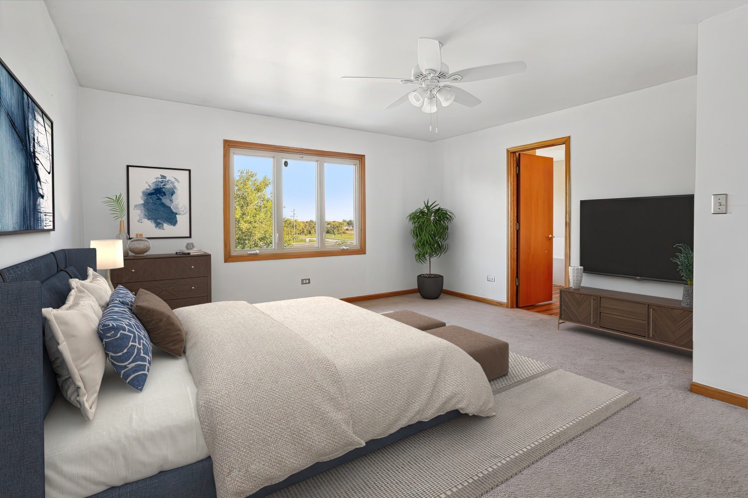 10646 Halligan Way Mokena, IL 60448 - Photo 19 of 28 a bedroom with a large bed and a flat screen tv