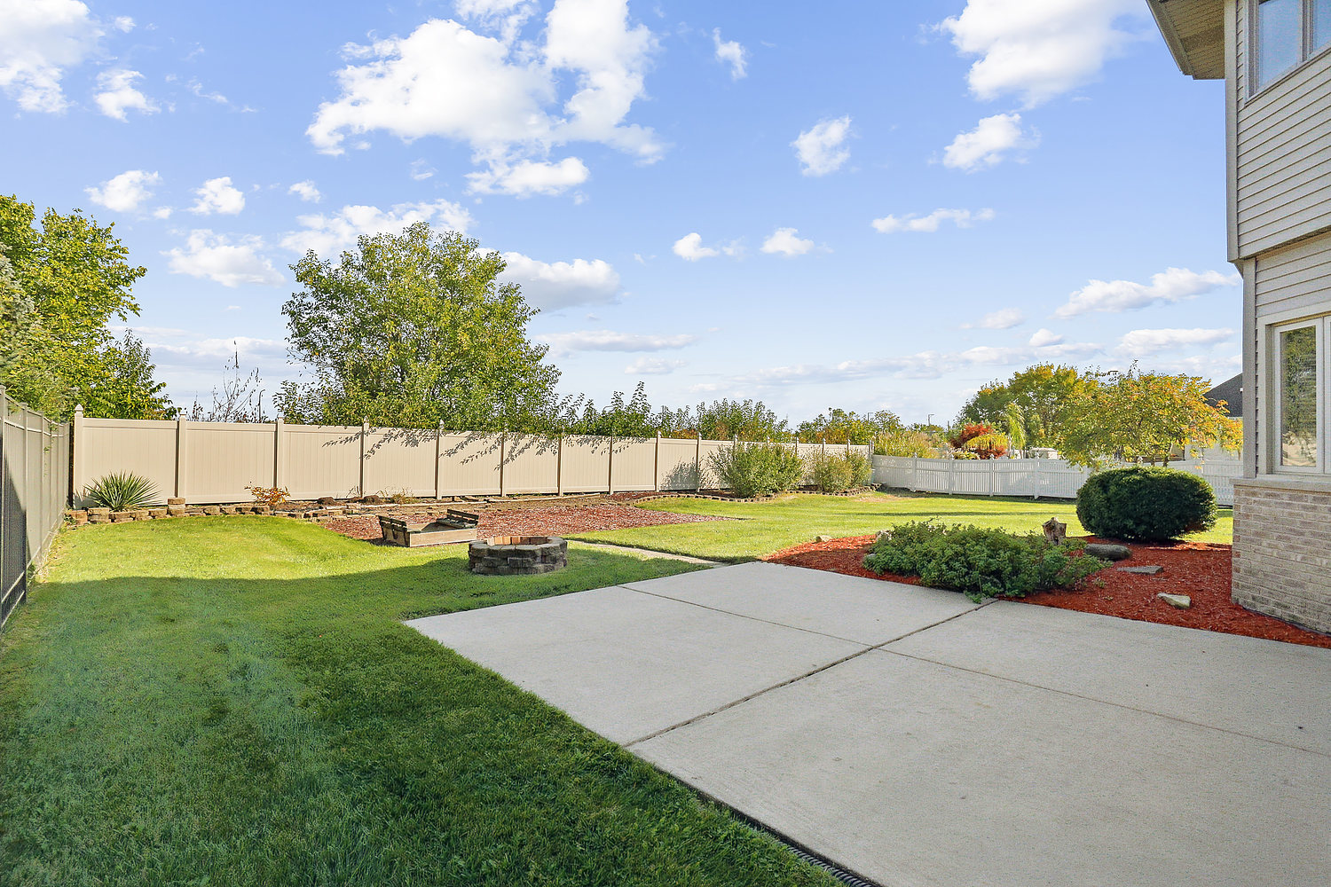 10646 Halligan Way Mokena, IL 60448 - Photo 10 of 28 a view of a swimming pool and a yard