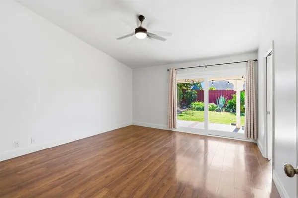 a spacious bathroom with a double vanity sink and a mirror