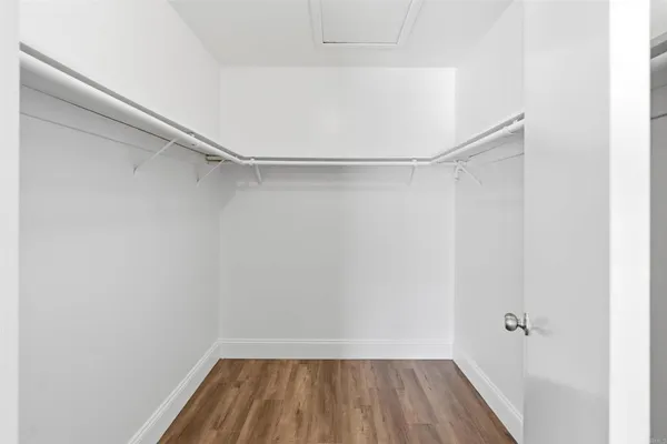 a view of room with hardwood floor and cabinet