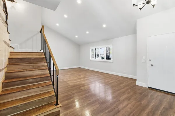 a view of entryway with wooden floor