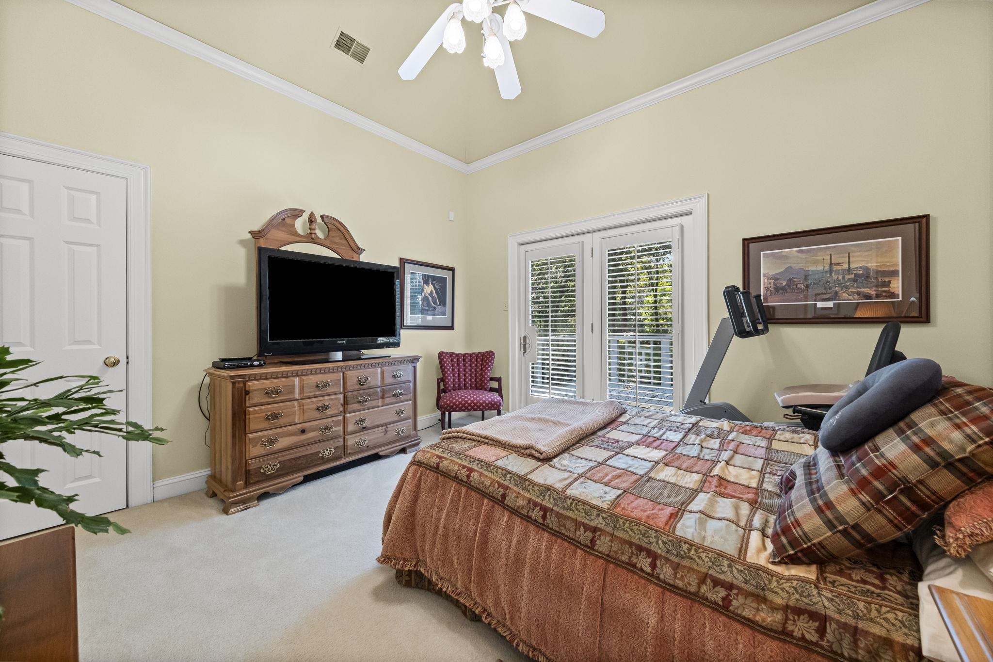 450 Cherry Road Eads, TN 38028 - Photo 19 of 24 Bedroom featuring crown molding, light colored carpet, access to outside, and ceiling fan
