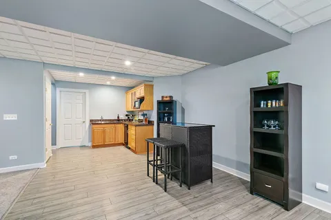 a view of kitchen with furniture and wooden floor