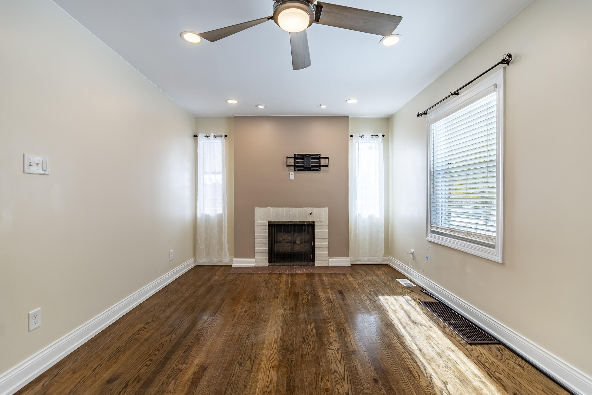 1035 Willard Street Gary, IN 46404 - Photo 11 of 30 a view of an empty room with a fireplace and a window