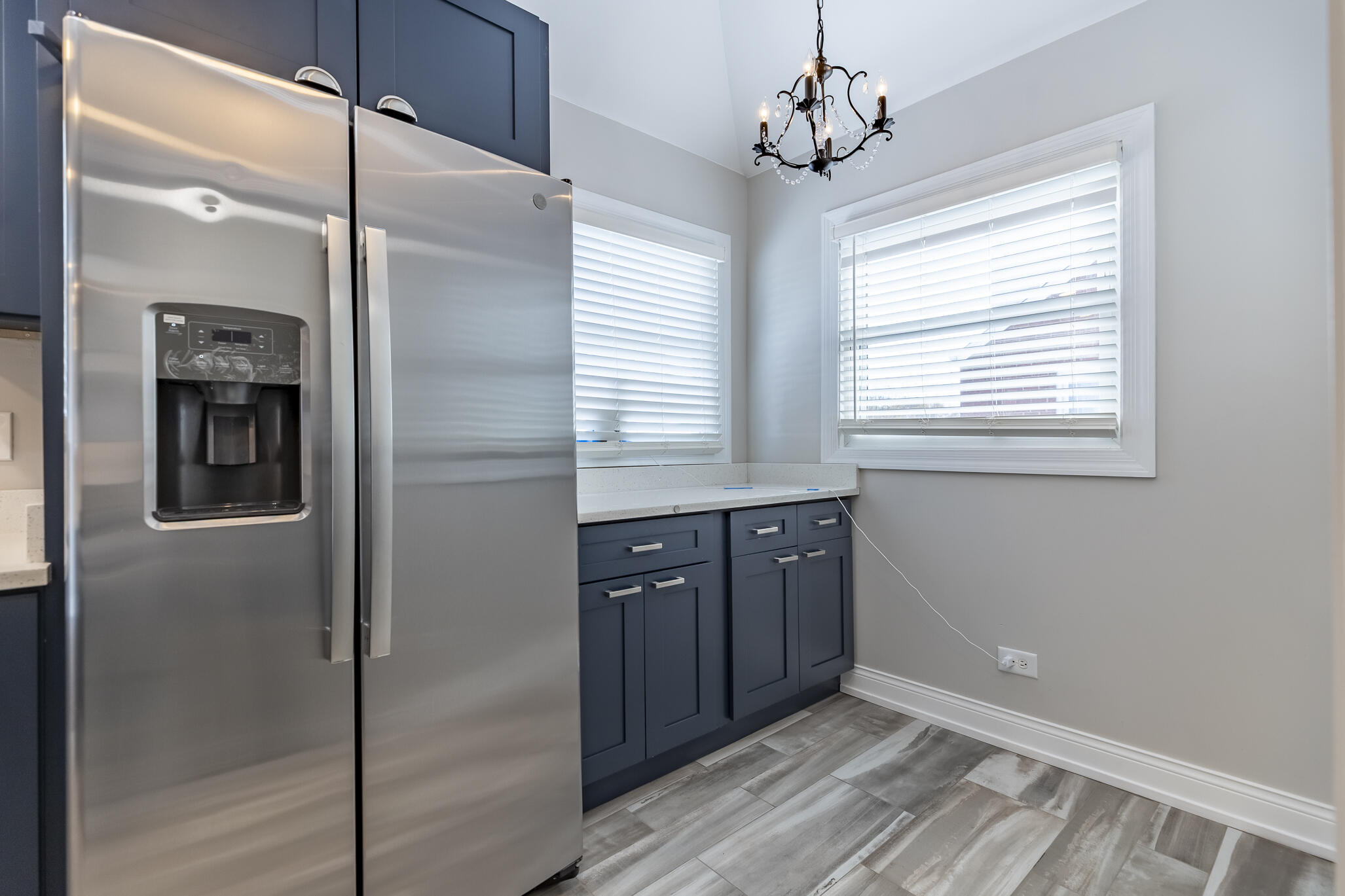 1035 Willard Street Gary, IN 46404 - Photo 18 of 30 a kitchen with stainless steel appliances granite countertop a refrigerator and a sink