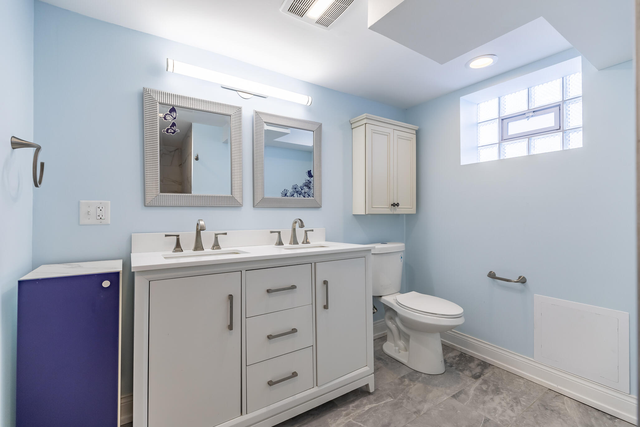 1035 Willard Street Gary, IN 46404 - Photo 23 of 30 a bathroom with a toilet sink and mirror