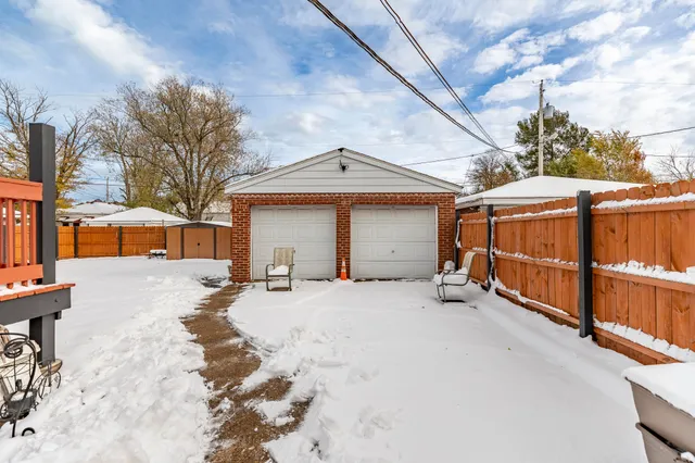 a view of a house with a snow in the yard