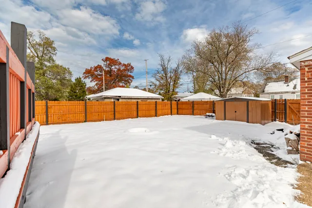 a view of a backyard of the house