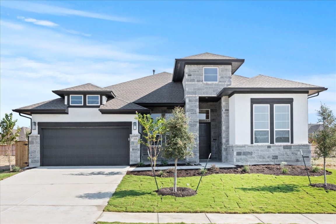 front view of a house with a yard