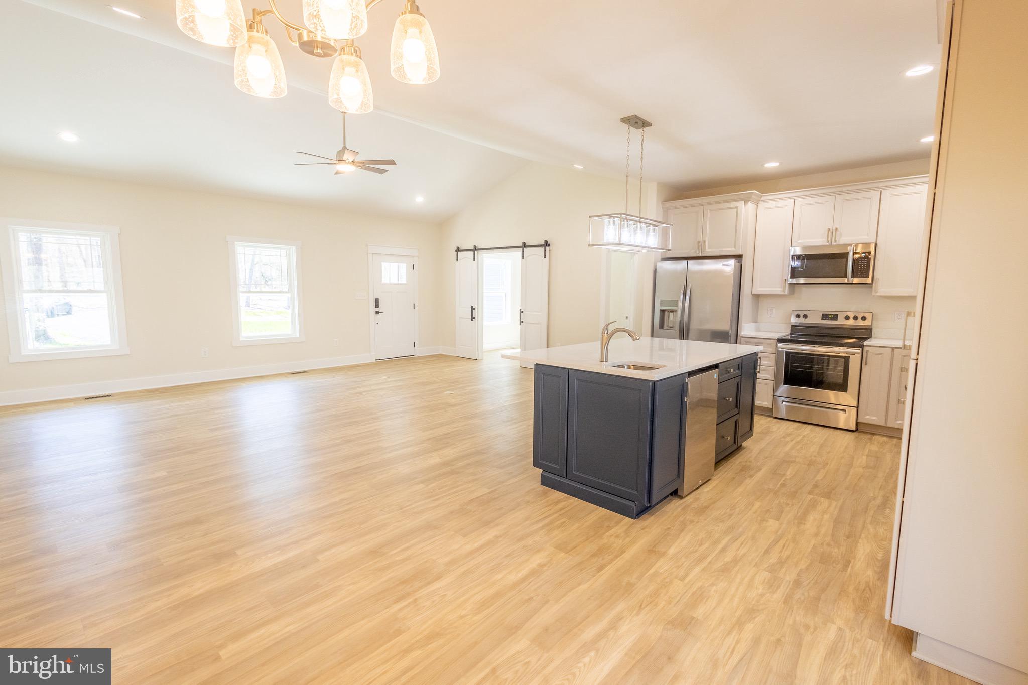 4 Windsor Drive King George, VA 22485 - Photo 11 of 48 a large kitchen with kitchen island a large counter top and stainless steel appliances