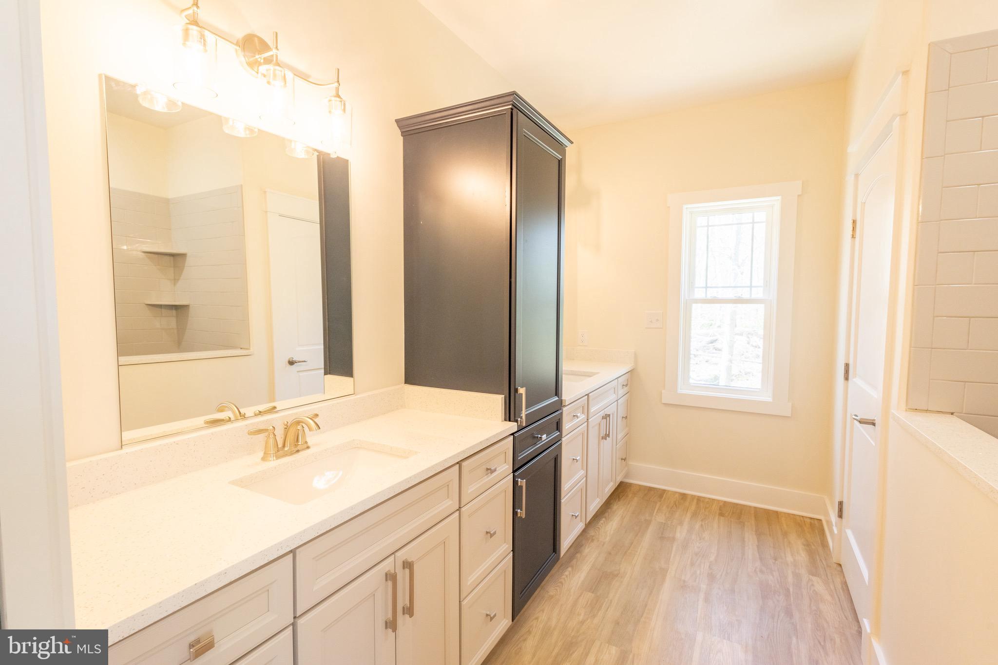 4 Windsor Drive King George, VA 22485 - Photo 23 of 48 a bathroom with a sink and a mirror