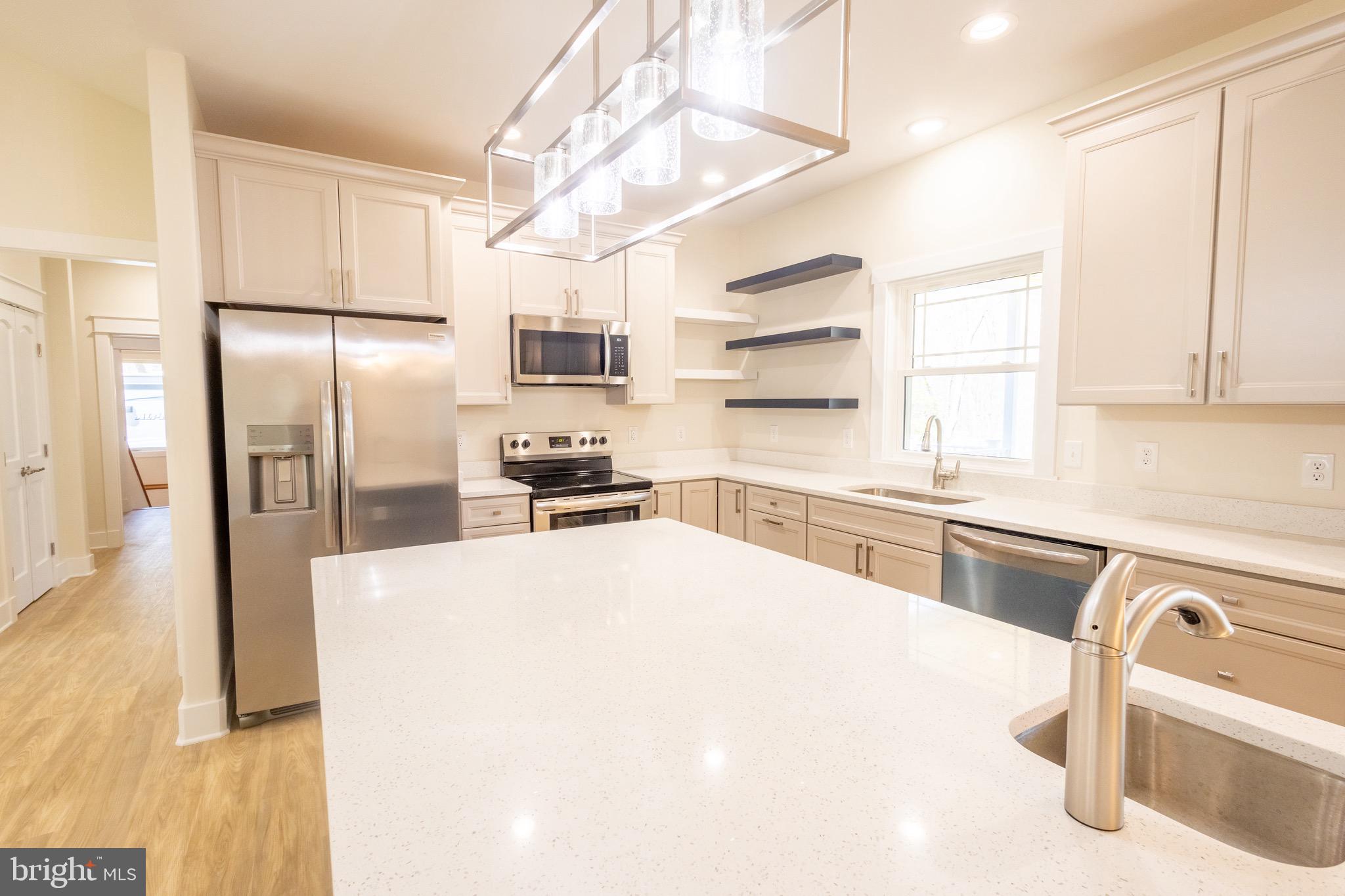 4 Windsor Drive King George, VA 22485 - Photo 6 of 48 a kitchen with stainless steel appliances a refrigerator sink and cabinets