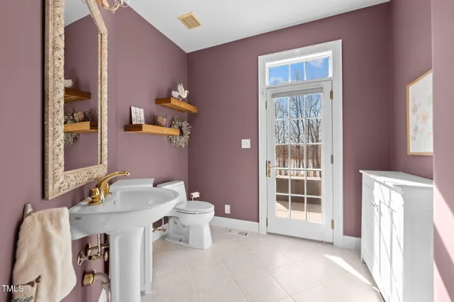 a view of a house with backyard porch and sitting area