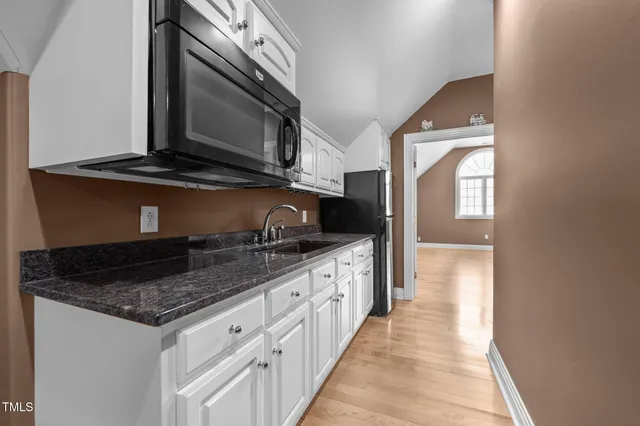 a backyard of a house with lots of trees