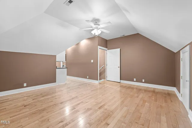 a backyard of a house with large trees