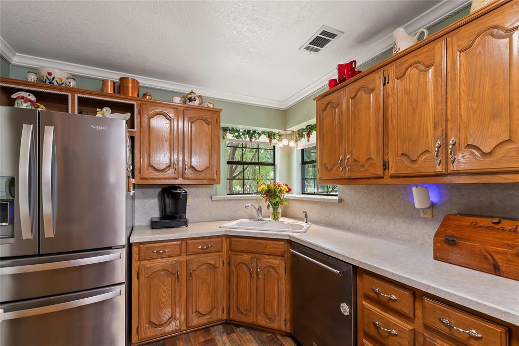 455 Stirrup Ranch Road Trinidad, TX 75163 - Photo 6 of 20 a kitchen with stainless steel appliances granite countertop a refrigerator and a sink