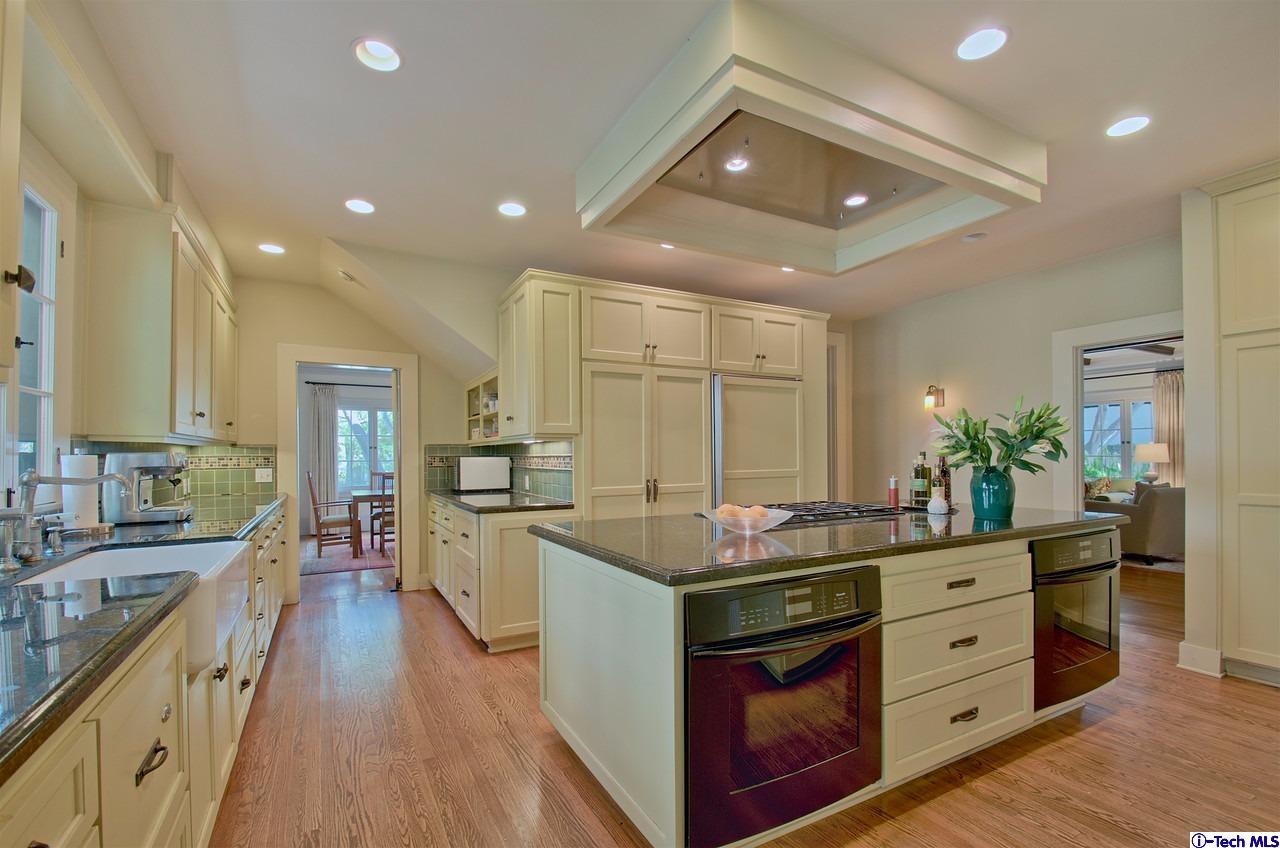 895 South Madison Avenue Pasadena, CA 91106 - Photo 11 of 38 a kitchen with stainless steel appliances granite countertop a sink and cabinets