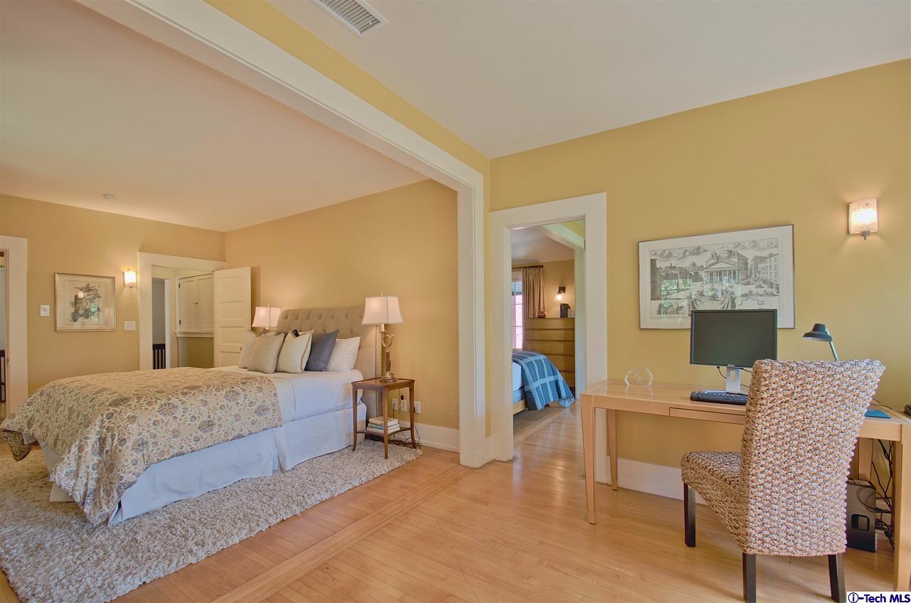 895 South Madison Avenue Pasadena, CA 91106 - Photo 20 of 38 a bedroom with a bed and furniture